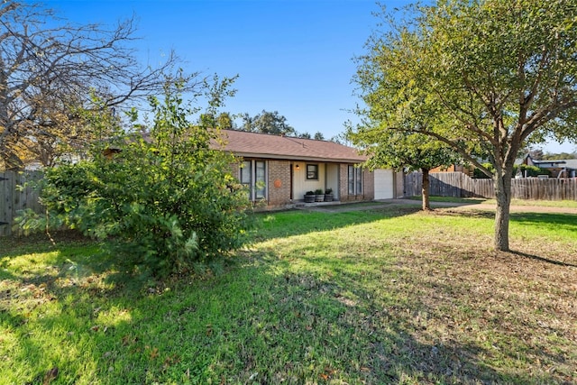 104 Thompson St, Cedar Park, TX 78613 - rear view of property featuring a garage, brick siding, and driveway