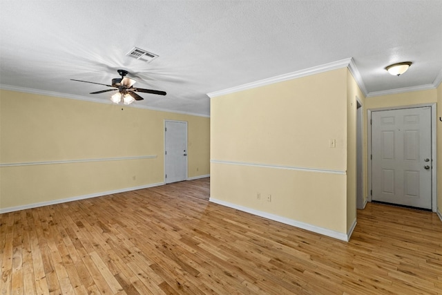 104 Thompson St, Cedar Park, TX 78613 - spare room featuring light wood-type flooring, ceiling fan, ornamental molding, and a textured ceiling