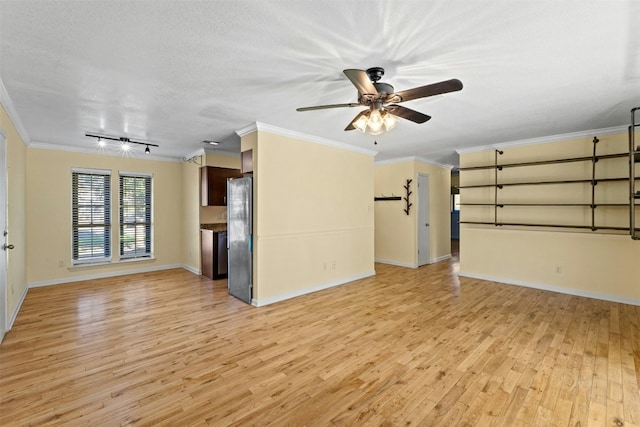 unfurnished living room with ceiling fan, ornamental molding, a textured ceiling, and light hardwood / wood-style flooring