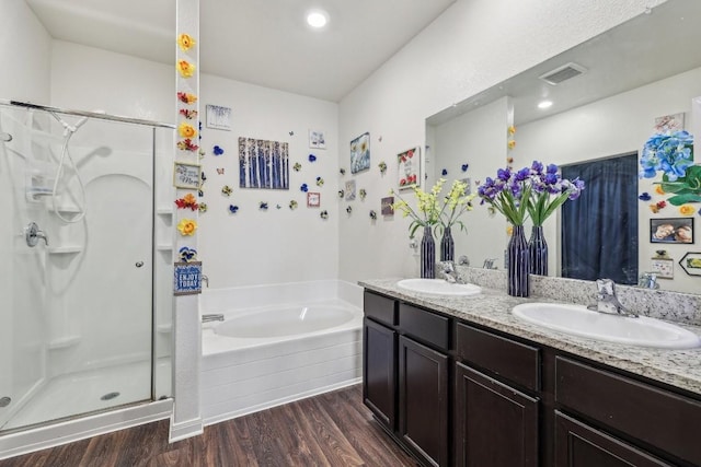 bathroom with vanity, shower with separate bathtub, and hardwood / wood-style flooring