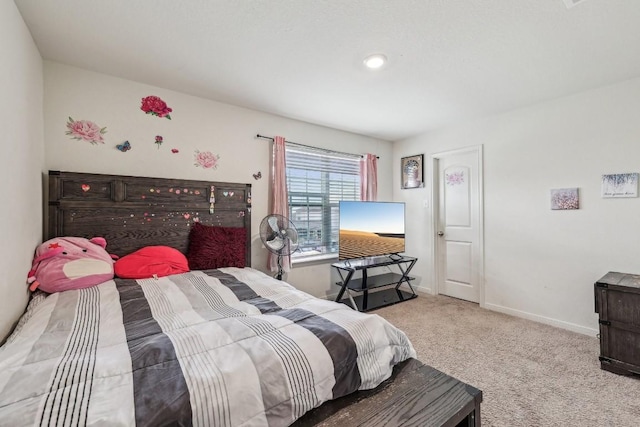 bedroom featuring light carpet