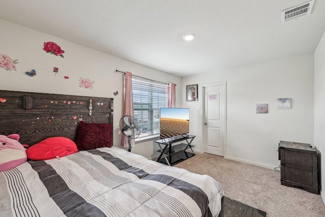 bedroom with light carpet