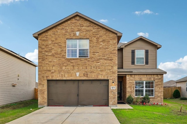 view of property with a garage and a front lawn