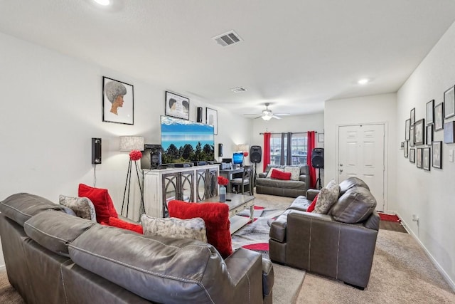 carpeted living room featuring ceiling fan