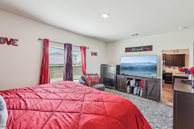 bedroom with hardwood / wood-style floors