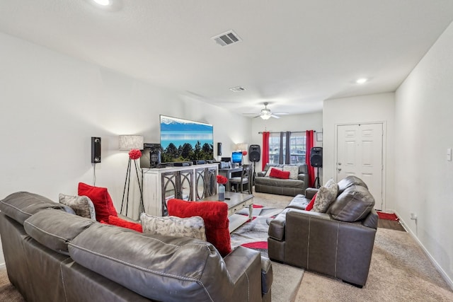 living room featuring ceiling fan and light colored carpet