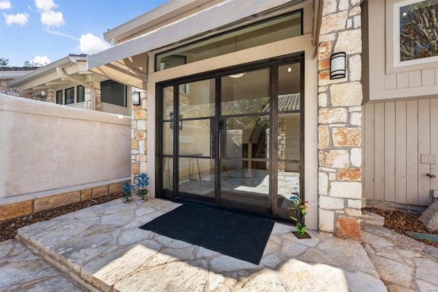 property entrance with a patio area