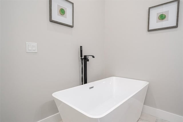 bathroom featuring a tub and sink