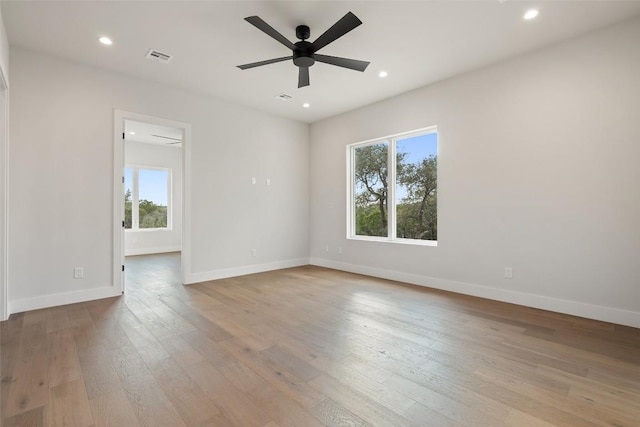 unfurnished room featuring ceiling fan and light hardwood / wood-style flooring