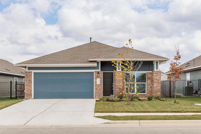 view of front of house with a garage and a front yard