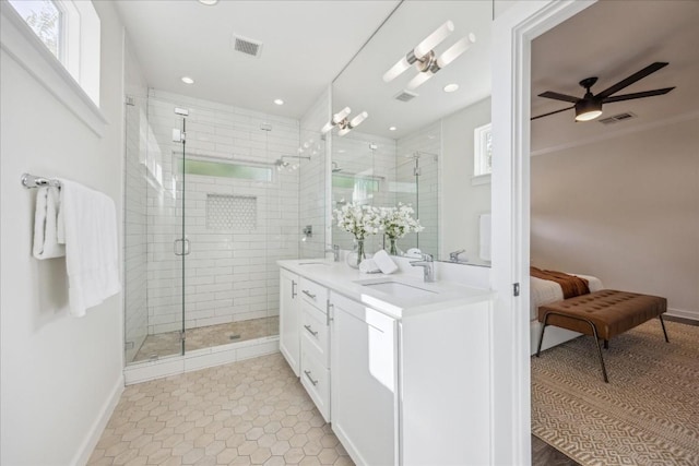 bathroom featuring ceiling fan, tile patterned flooring, vanity, and an enclosed shower