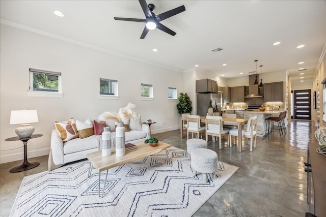 living room with ceiling fan and ornamental molding