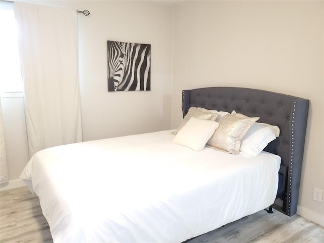 bedroom with light hardwood / wood-style flooring