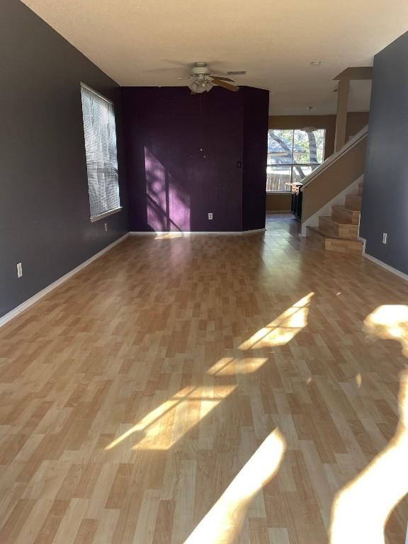 interior space with hardwood / wood-style flooring and ceiling fan