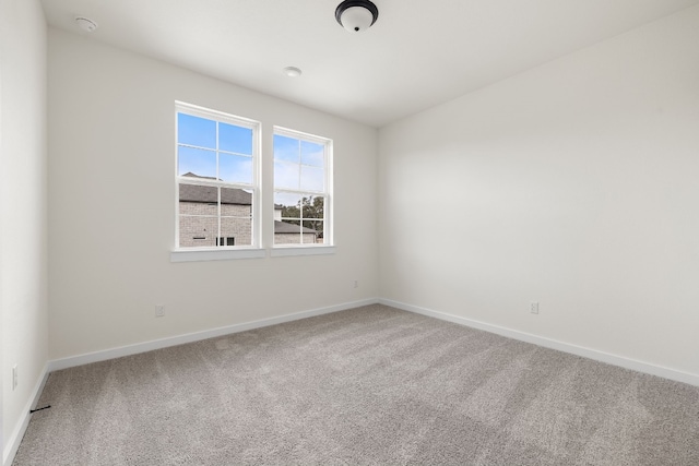 unfurnished room featuring carpet floors