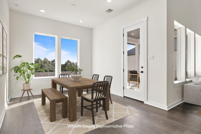 dining area featuring dark hardwood / wood-style floors