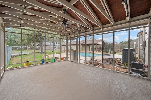 unfurnished sunroom featuring lofted ceiling and ceiling fan