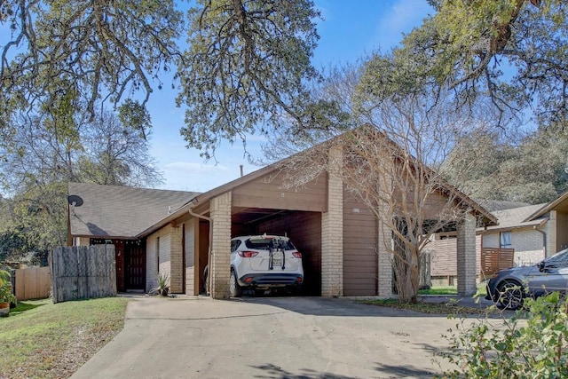 view of front of property featuring a carport