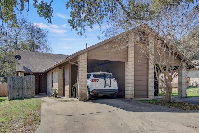 view of side of home featuring a carport