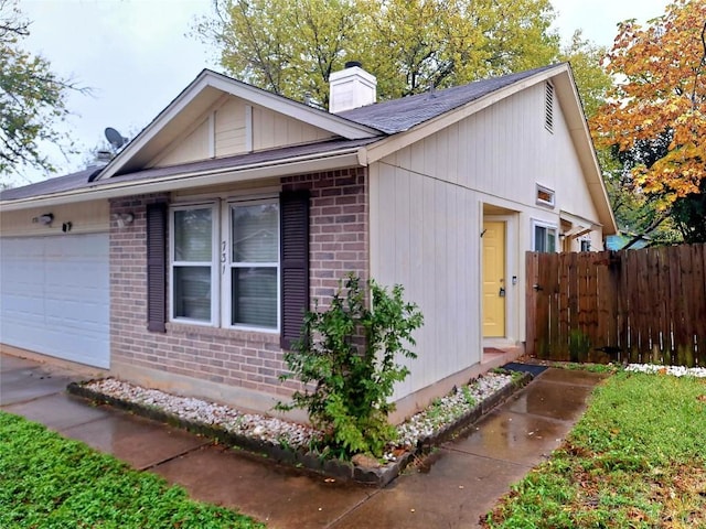 view of property exterior with a garage