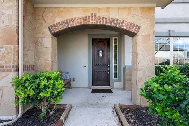 view of exterior entry with stone siding