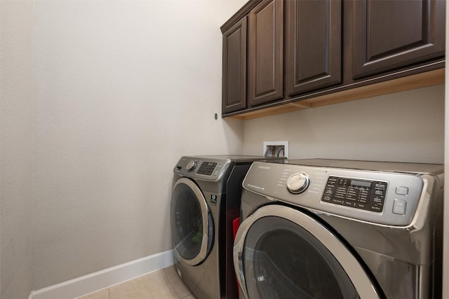 2715 Mariposa Way, Round Rock, TX 78665 - laundry room featuring cabinet space, washer and clothes dryer, and tile patterned floors