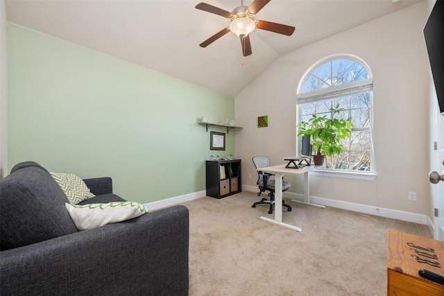 carpeted office space with baseboards, lofted ceiling, and ceiling fan