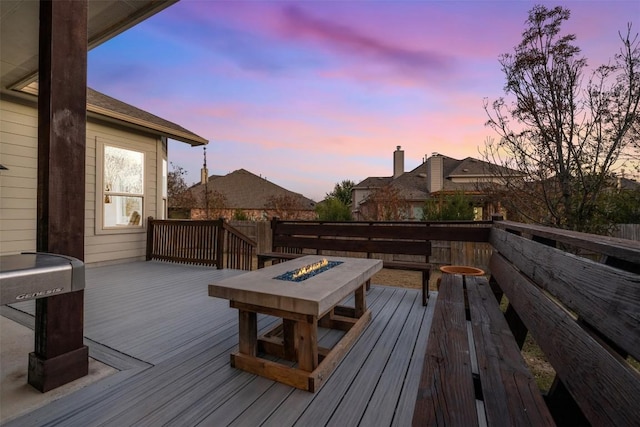 2715 Mariposa Way, Round Rock, TX 78665 - deck at dusk featuring a fire pit
