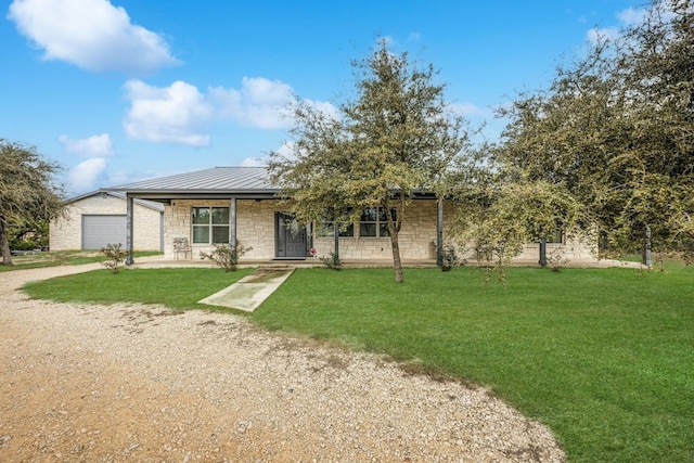 view of front of house with a garage, a porch, and a front yard