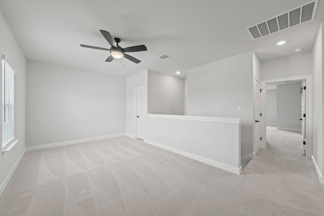 carpeted empty room with ceiling fan