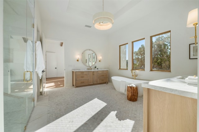 bathroom featuring vanity and plus walk in shower