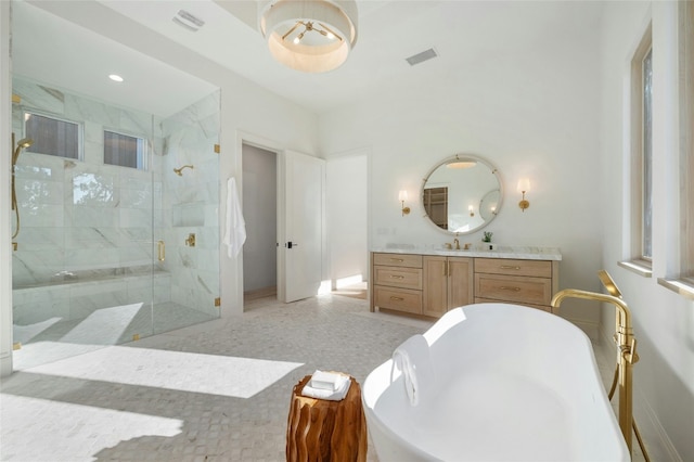 bathroom with tile patterned flooring, vanity, and independent shower and bath