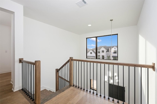 7501 Becasseau Dr, Austin, TX 78738 - stairway with wood finished floors and baseboards