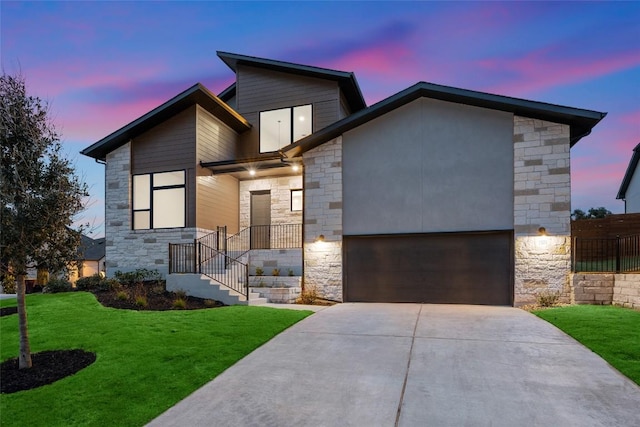 7501 Becasseau Dr, Austin, TX 78738 - contemporary home featuring stone siding, driveway, and a yard