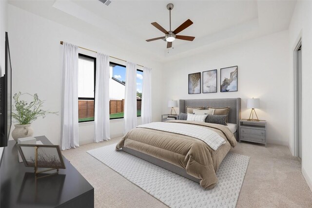 7501 Becasseau Dr, Austin, TX 78738 - carpeted bedroom featuring a tray ceiling and a ceiling fan