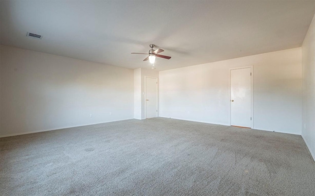 spare room featuring carpet flooring and ceiling fan