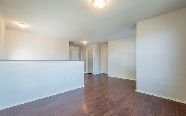 unfurnished room featuring dark hardwood / wood-style floors