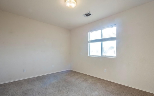 empty room featuring carpet floors