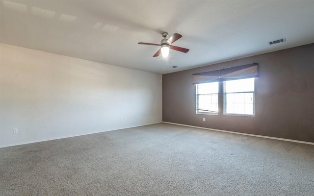 carpeted empty room with ceiling fan