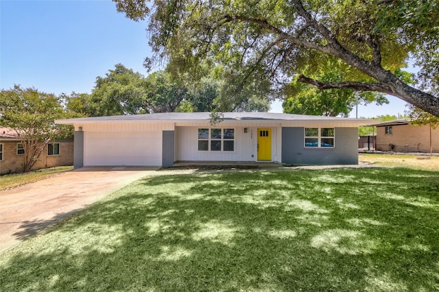 ranch-style home featuring a front lawn and a garage