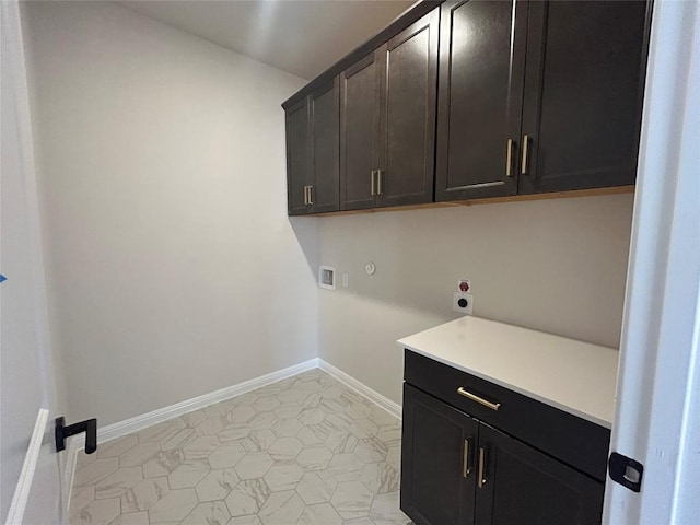 laundry area with cabinet space, baseboards, washer hookup, and hookup for an electric dryer