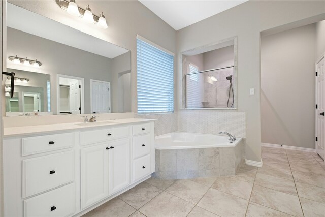 bathroom featuring vanity, separate shower and tub, and tile patterned floors