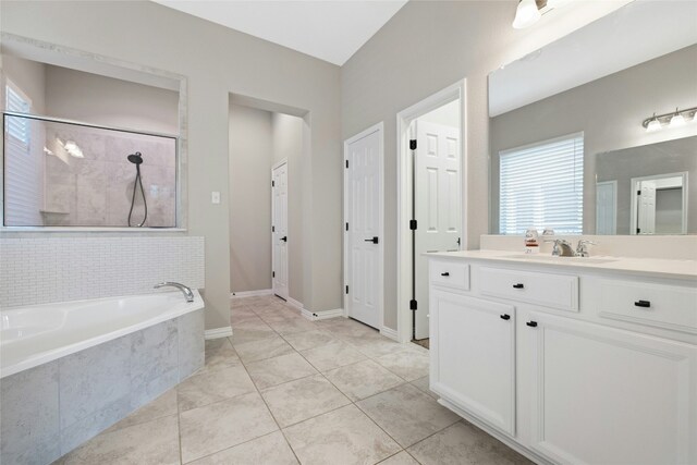 bathroom featuring tile patterned floors, vanity, and independent shower and bath