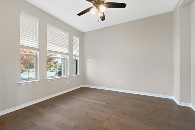 unfurnished room featuring ceiling fan and dark hardwood / wood-style flooring