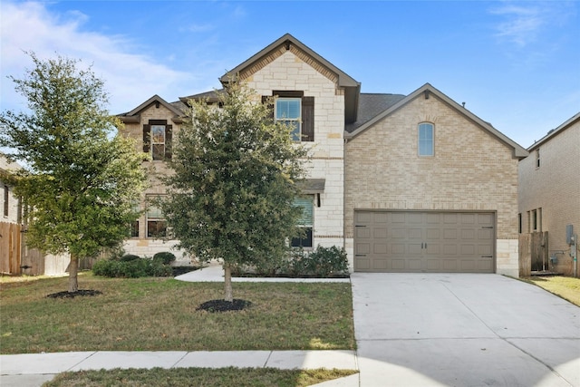 view of front of home featuring a garage and a front lawn