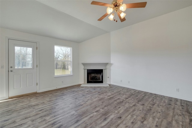 unfurnished living room with ceiling fan and light wood-type flooring