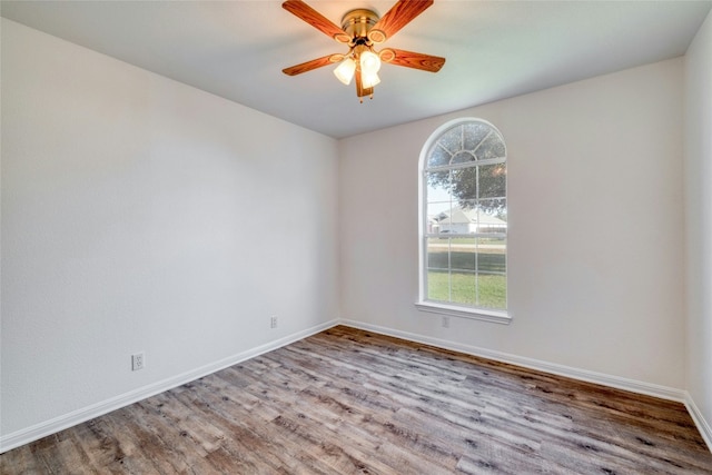 empty room with ceiling fan and light wood-type flooring