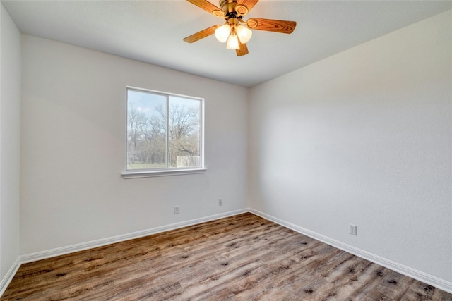 unfurnished room featuring hardwood / wood-style flooring and ceiling fan