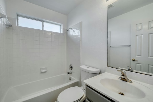 full bathroom with bathtub / shower combination, vanity, and toilet