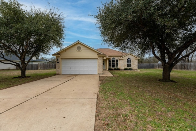 ranch-style house featuring a garage and a front yard